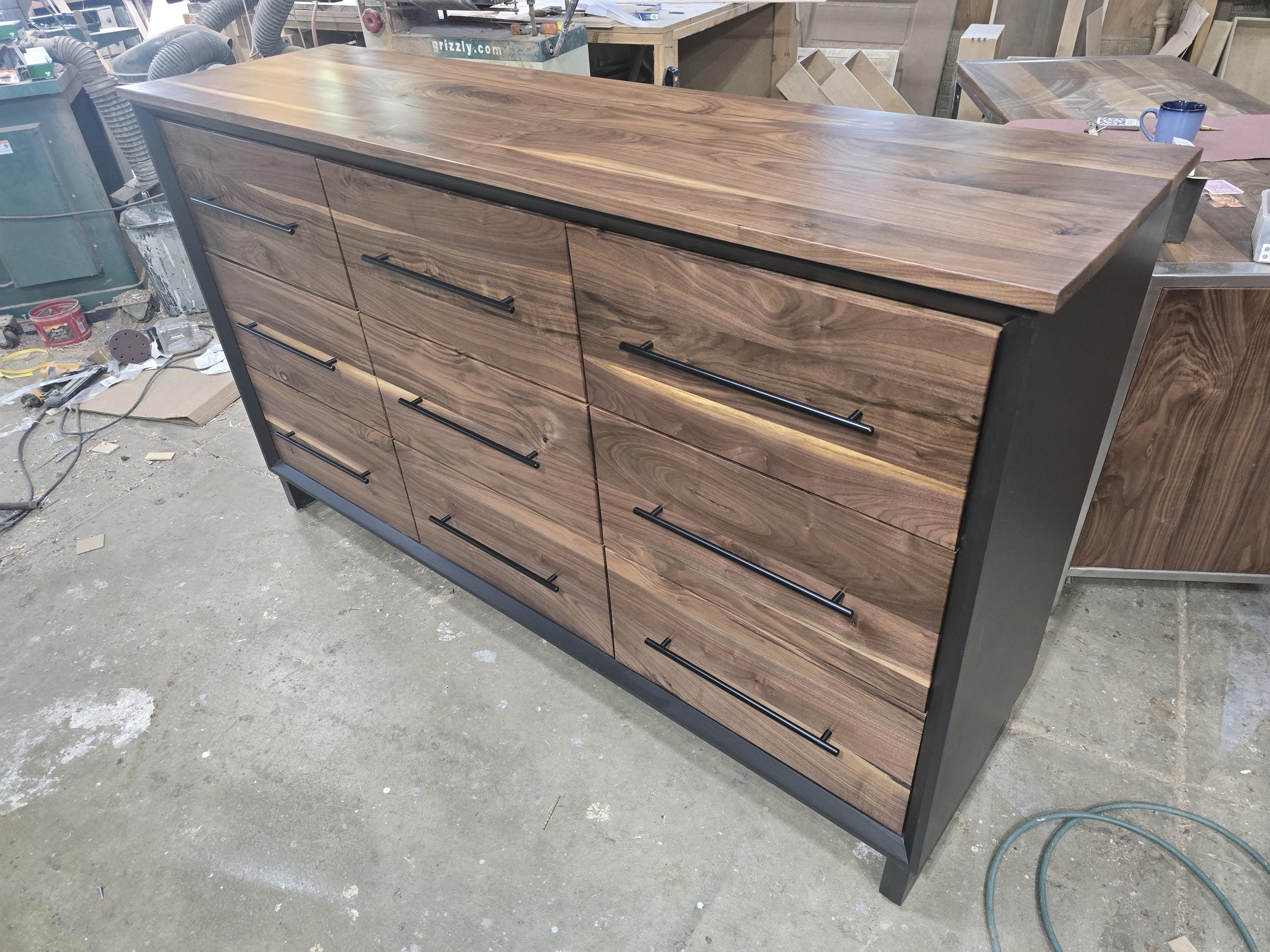6foot 9 drawer walnut faced modern dresser in black with solid walnut top on steel legs.