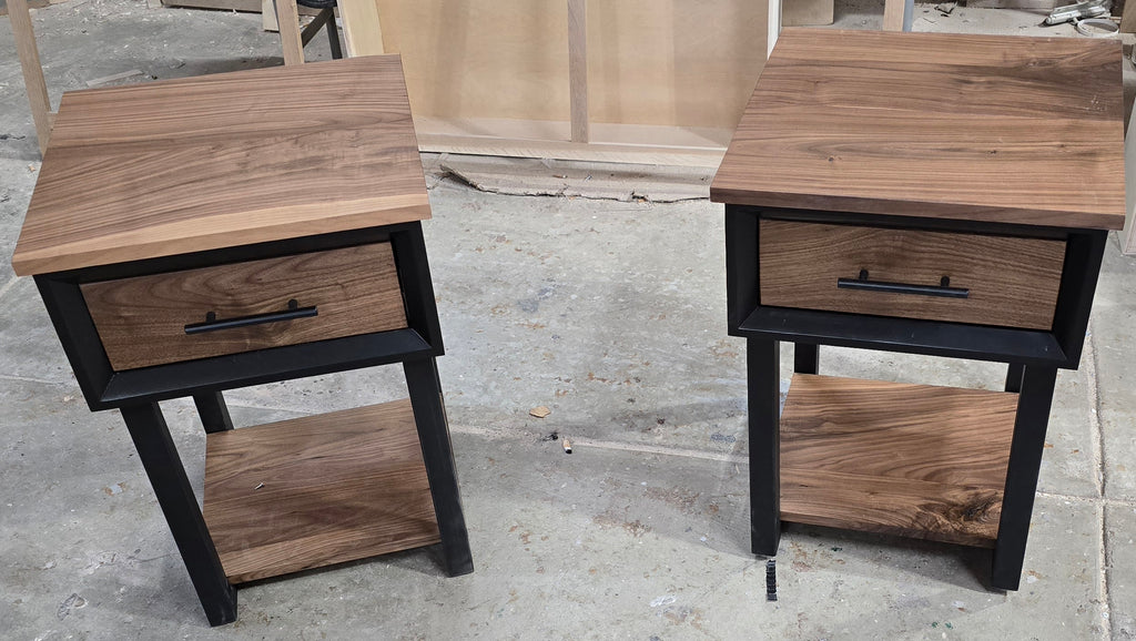 Modern Black and walnut nightstand with drawer and shelf on steel legs.