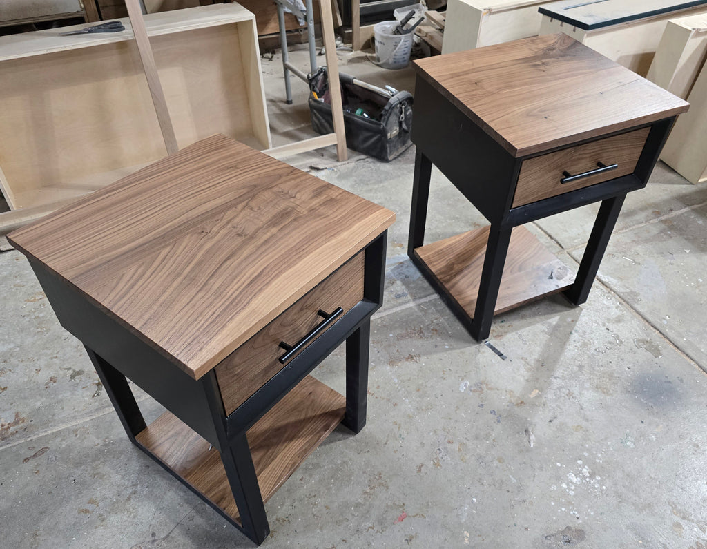 Modern Black and walnut nightstand with drawer and shelf on steel legs.