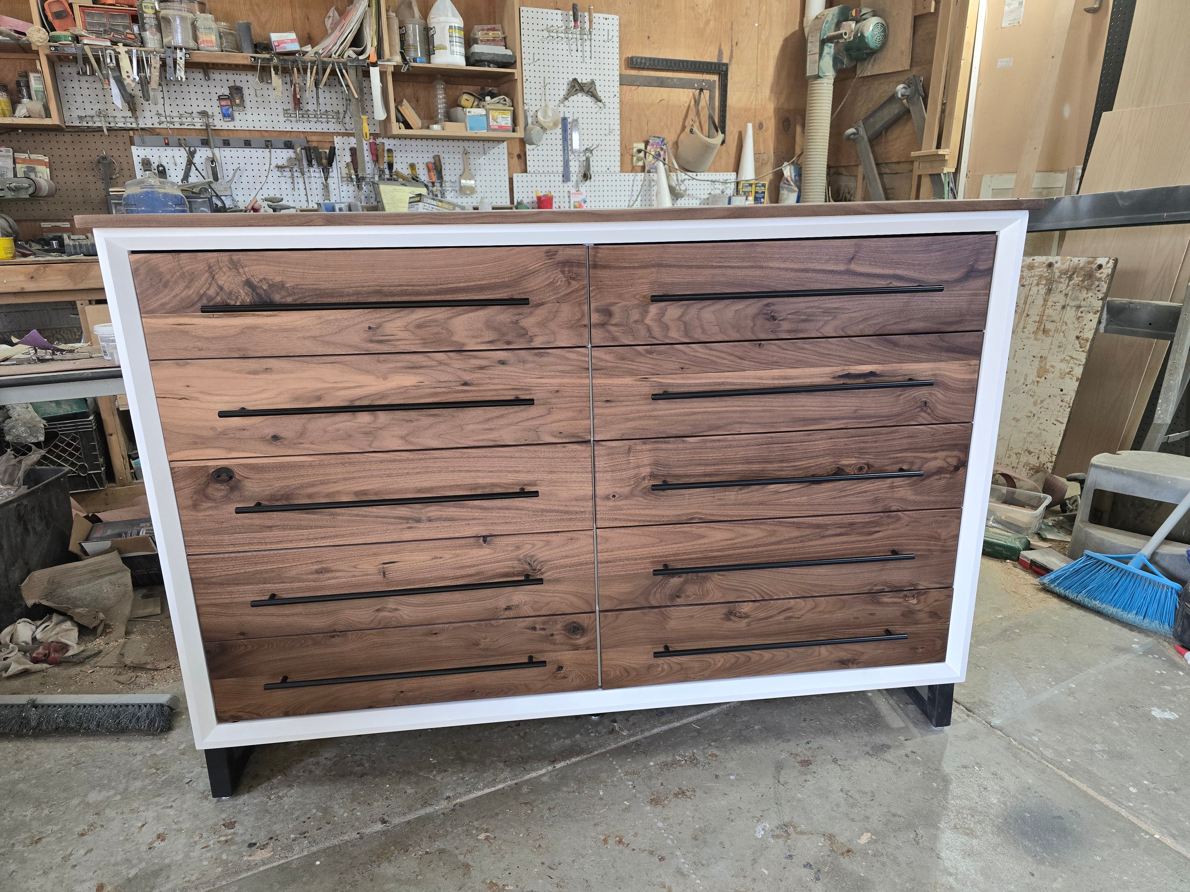 Handcrafted modern 8 drawer dresser in white with real walnut on 5" steel legs