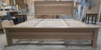 Low front view of white oak footboard, legs and exposed slat base