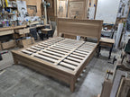 Wide workshop view of white oak bed frame from the footboard corner