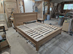 Elevated angled view of white oak platform bed in the workshop
