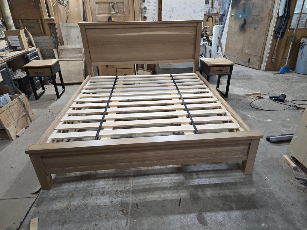 Front workshop view of white oak bed with slatted base and low footboard
