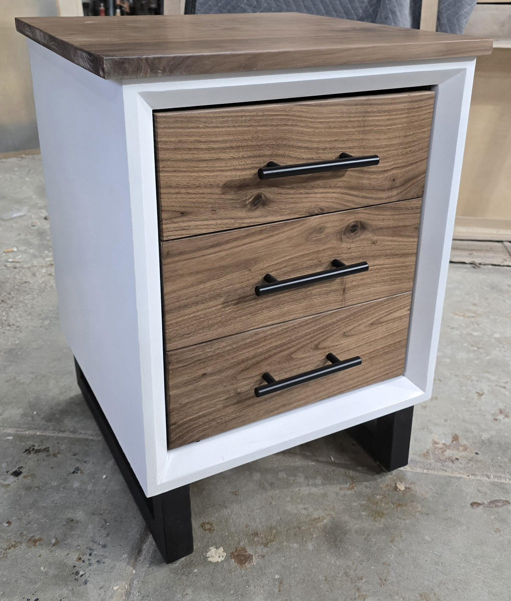 Handcrafted to order. 3 drawer nightstand in a white finish with real walnut fronts and top.