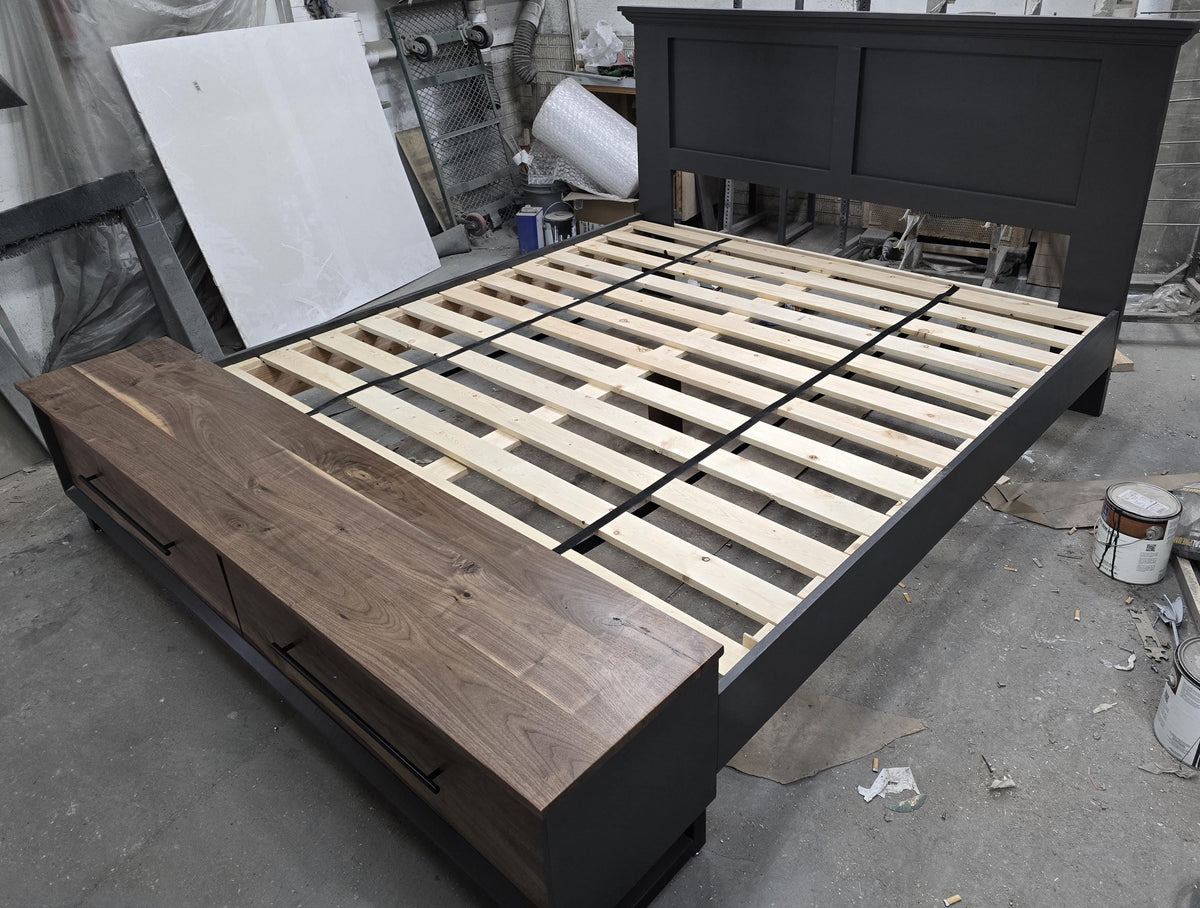Elevated view of storage-bed slats, dark headboard and wood-grain footboard bench