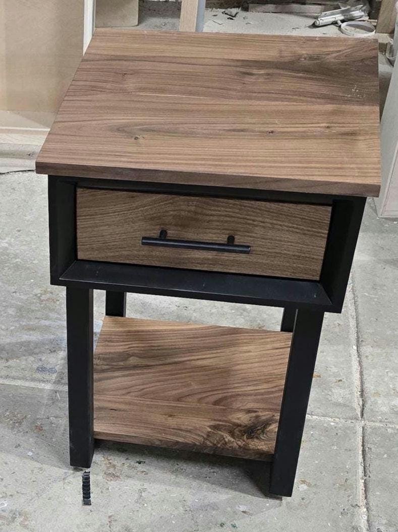 Handcrafted single drawer modern nightstands in black with real walnut and bottom shelf on steel legs