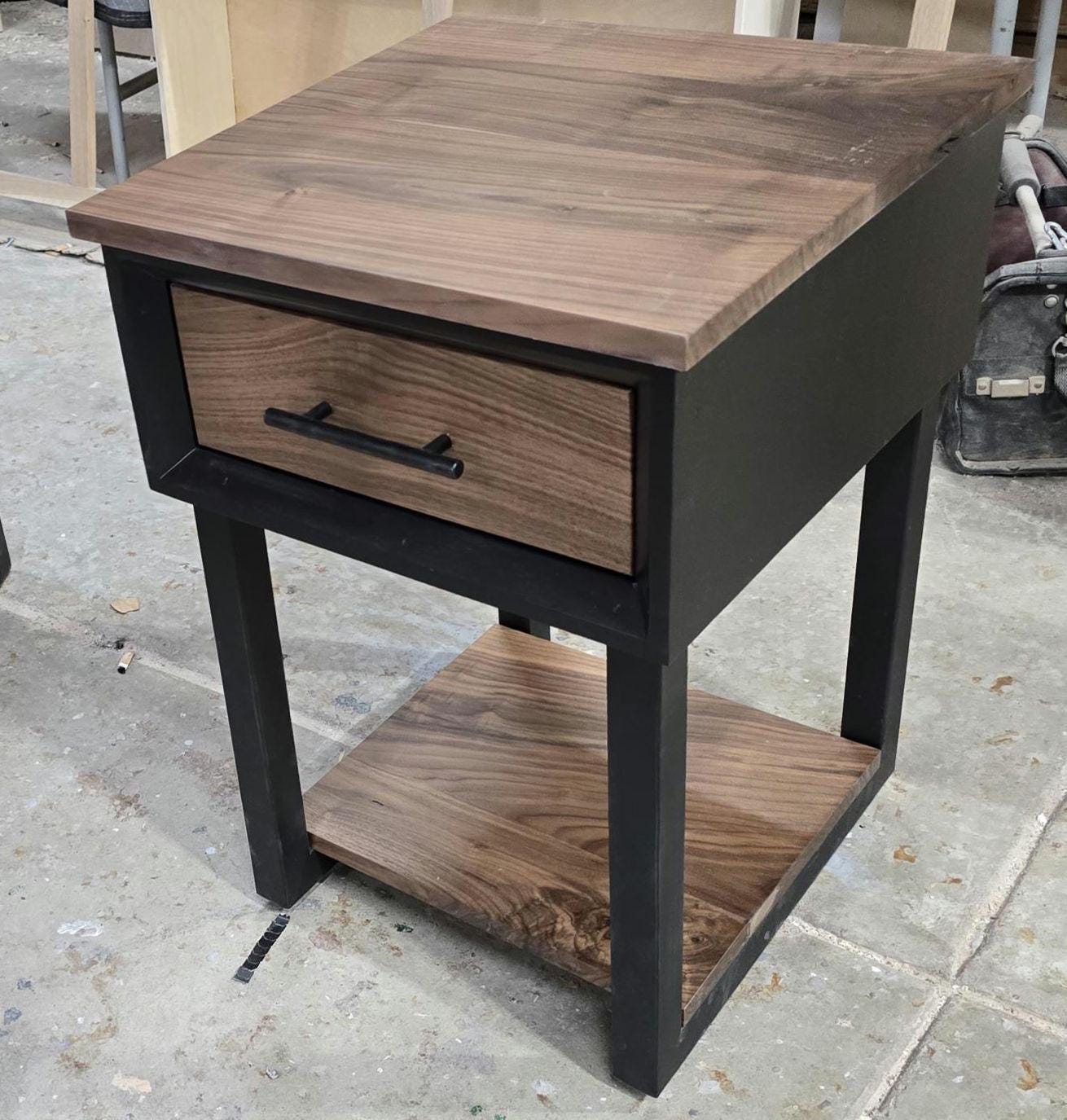 Handcrafted single drawer modern nightstands in black with real walnut and bottom shelf on steel legs