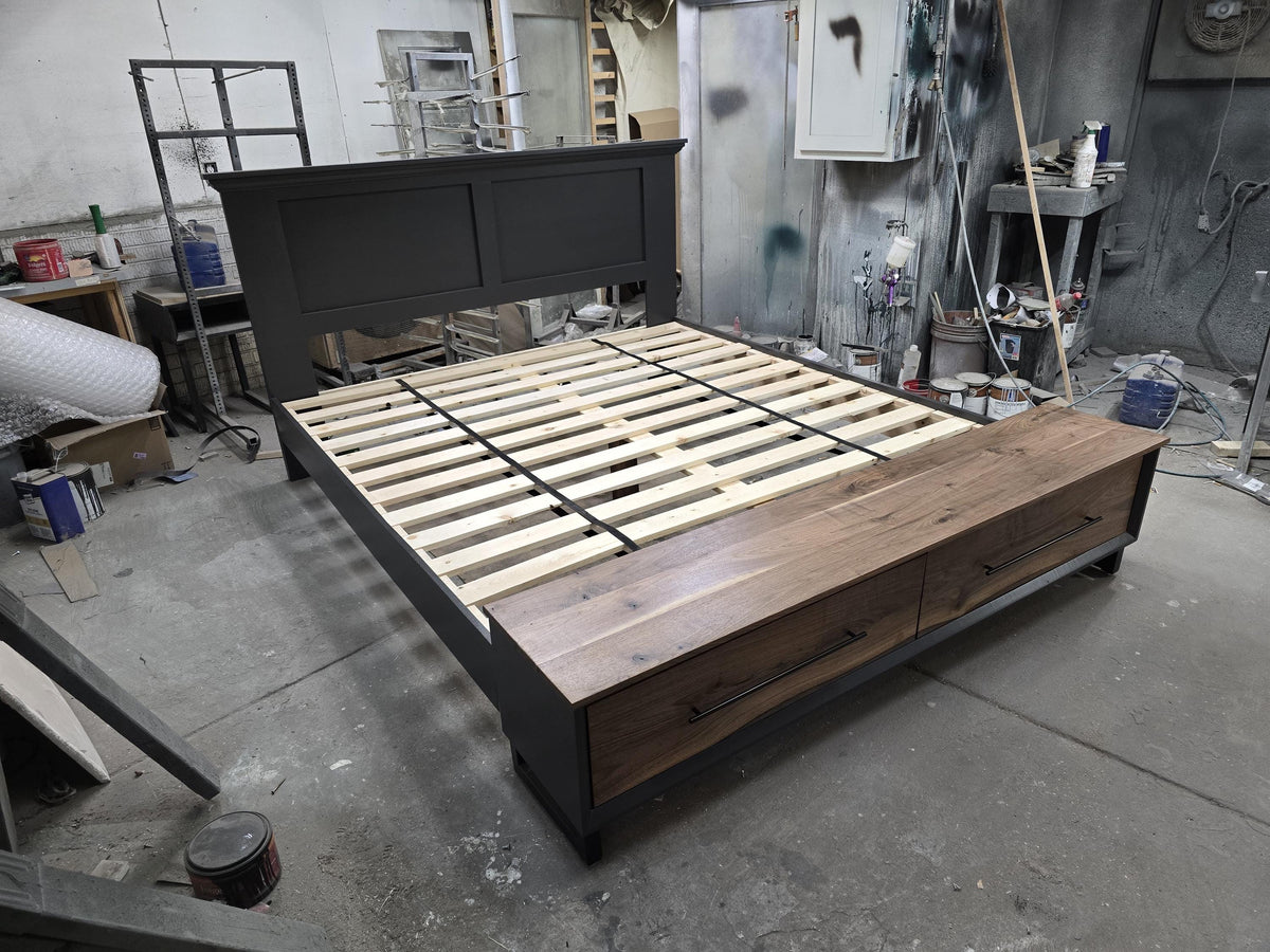 Angled workshop view of storage bed with exposed slats and footboard bench