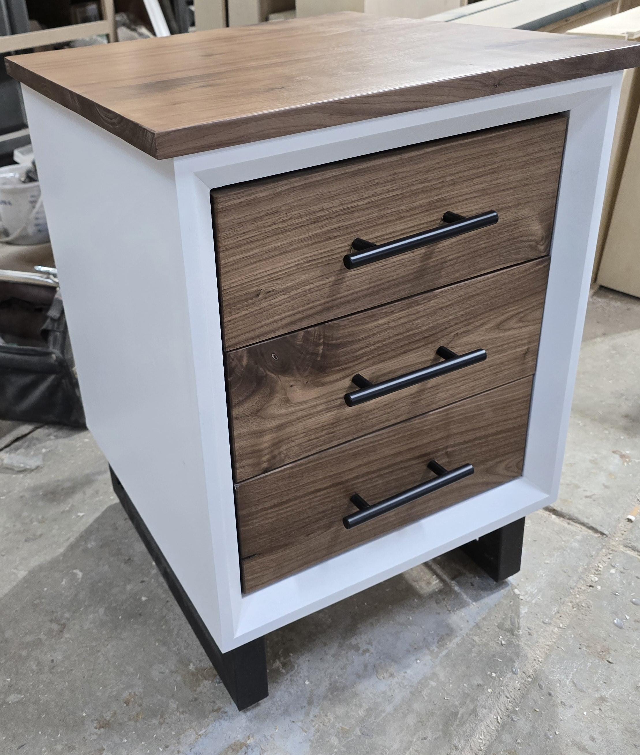 Handcrafted to order. 3 drawer nightstand in a white finish with real walnut fronts and top.