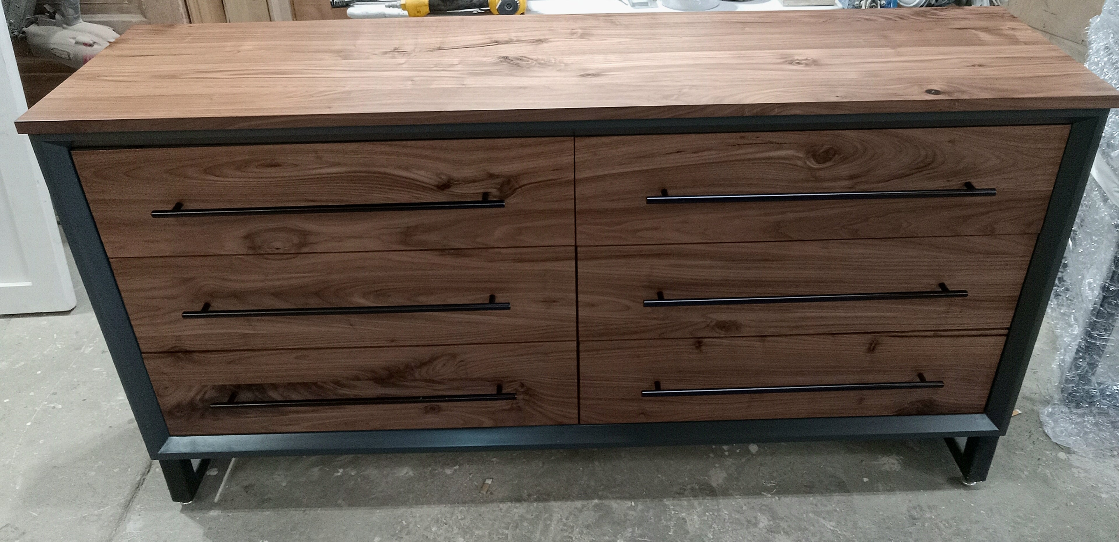 60" Modern 6 drawer dresser in iron finish with walnut fronts and top.
