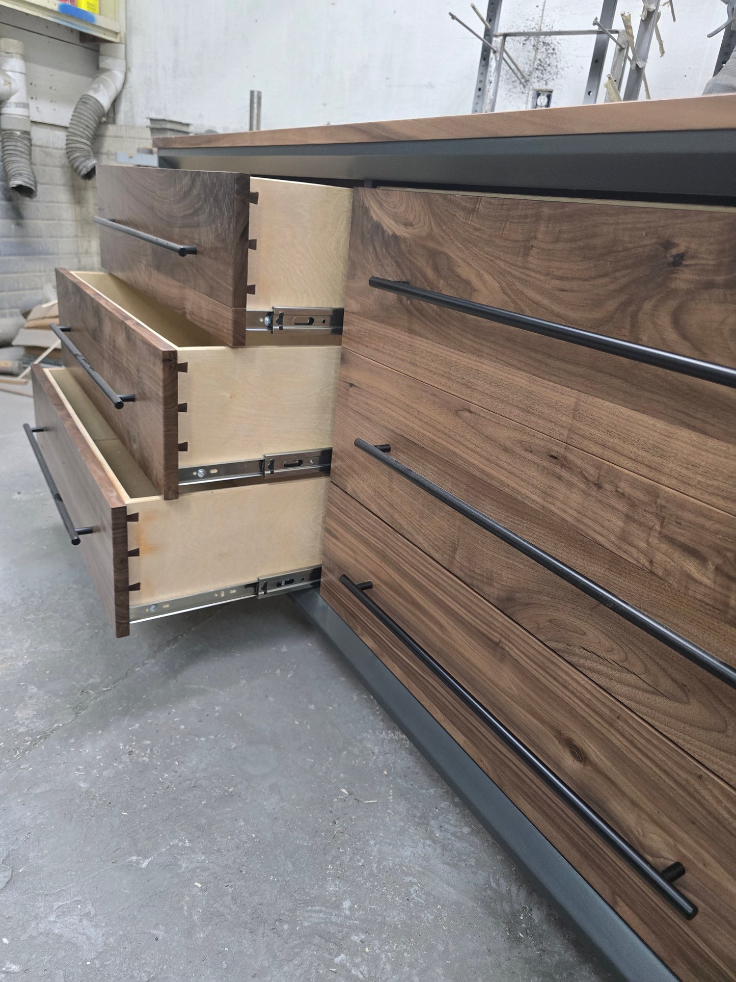 60" Modern 6 drawer dresser in iron finish with walnut fronts and top.